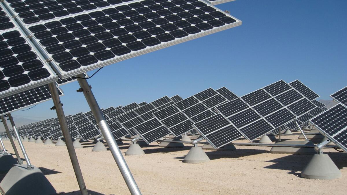 Shown is a SunPower Corp. solar installation at Nellis Air Force Base in Nevada. The company is boosting production of solar panels in the United States.