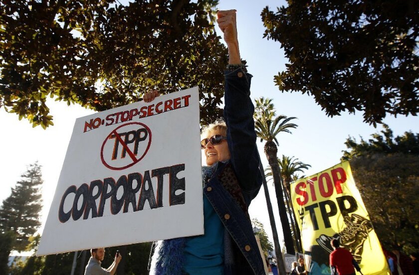Protesters are seen in Beverly Hills last year demonstrating against the proposed Trans-Pacific Partnership trade deal during a visit to Southern California by President Obama.