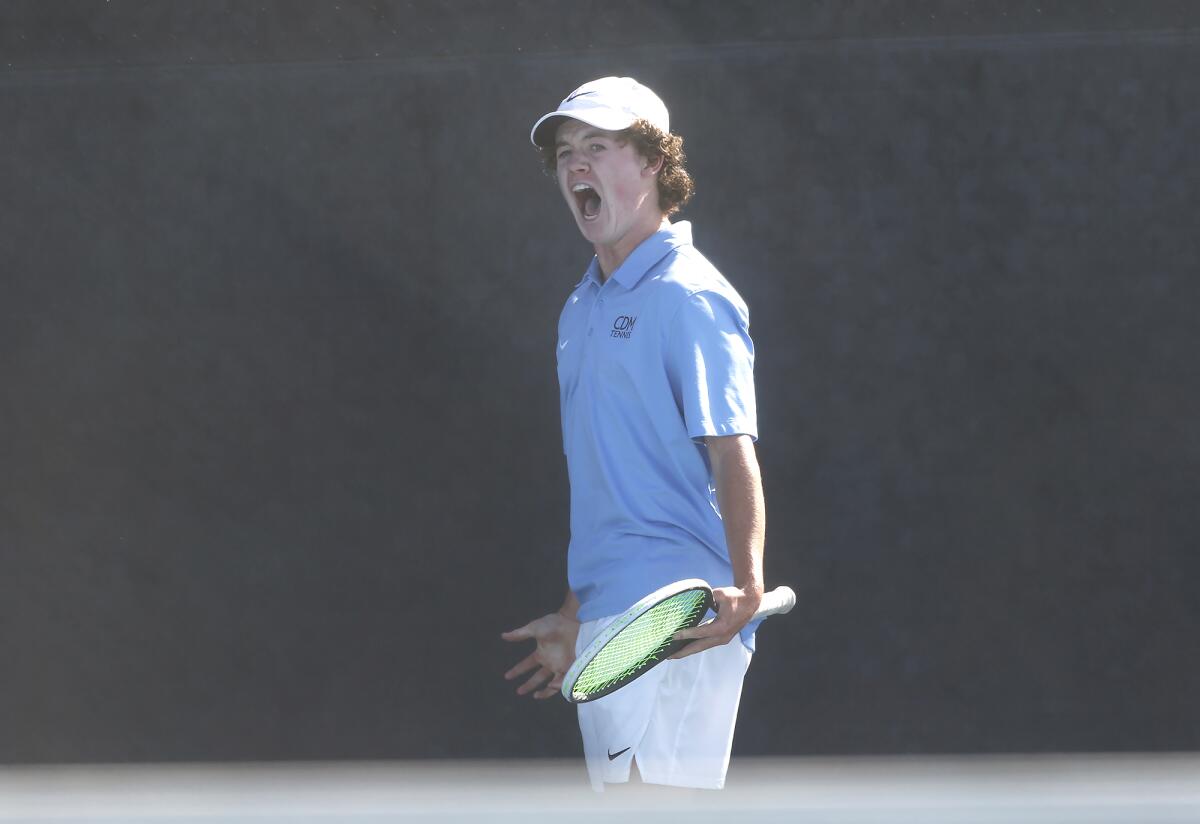Jack Cross reacts to winning a long point during a singles match against Palos Verdes Peninsula opponent on Wednesday.