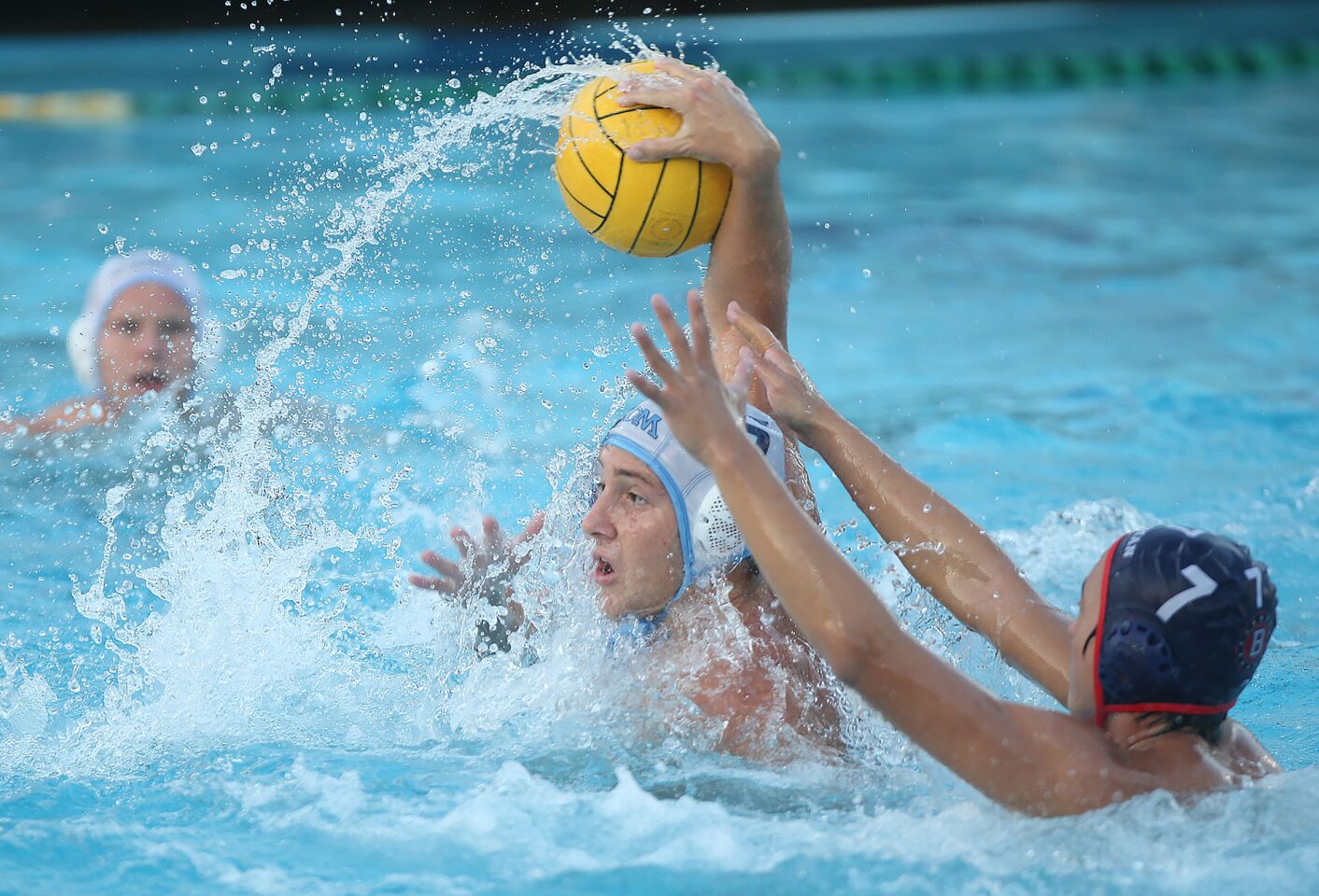 Corona Del Mar High's Matt Ueberroth takes a shot as the defense closes from Beckman's Richard Yoon (7) during wild-card round of the CIF Southern Section Division 2 playoffs at Beckman on Tuesday.