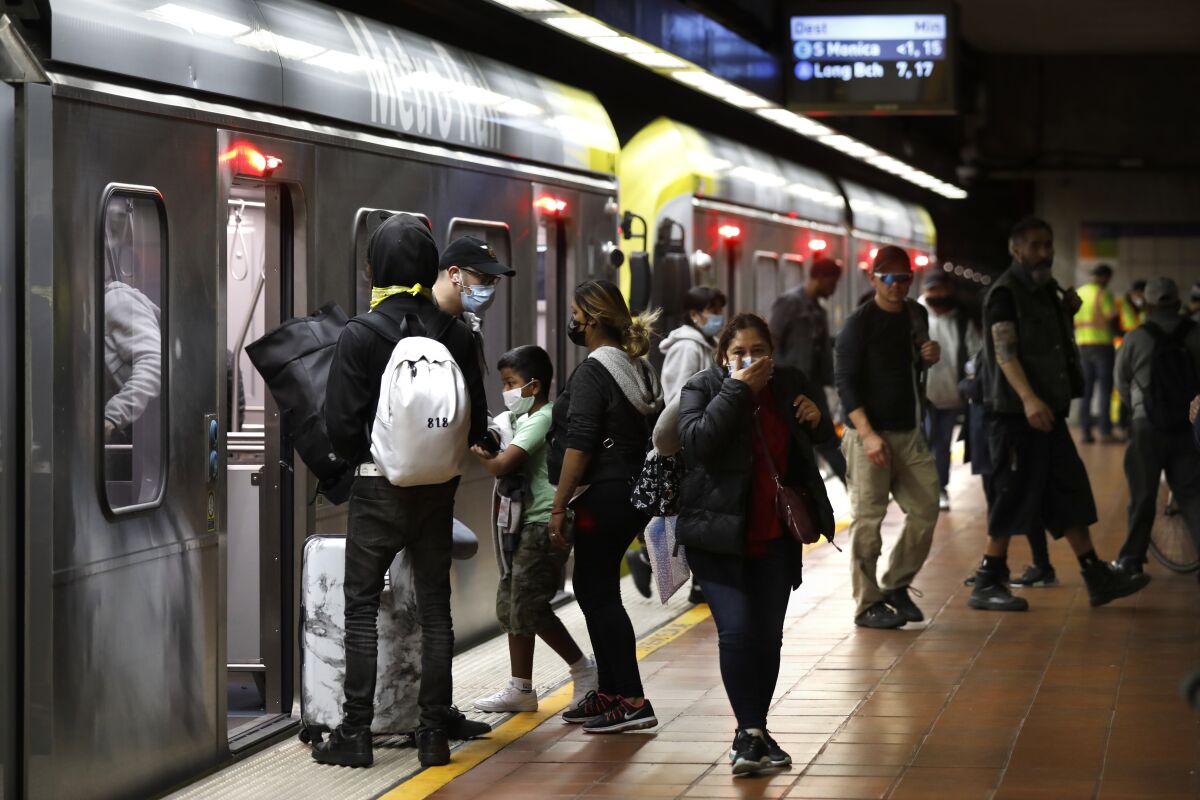 Metro riders get off or board trains at a station in downtown L.A.