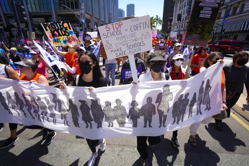 Hundreds of demonstrators peacefully marched down Broadway in downtown on Saturday, June 11, 2022 in San Diego, CA.