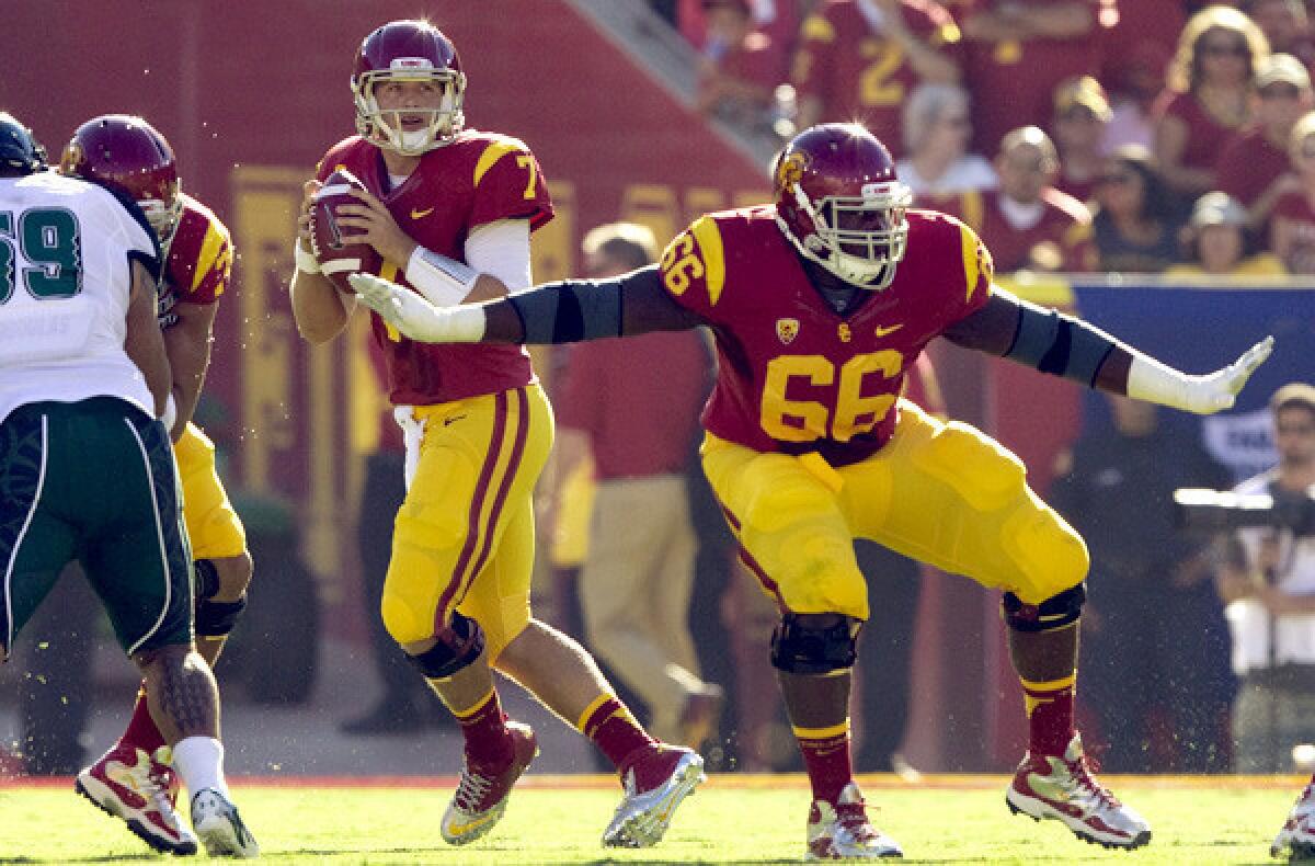 Marcus Martin (66) started two seasons at guard and one season at center for the Trojans.