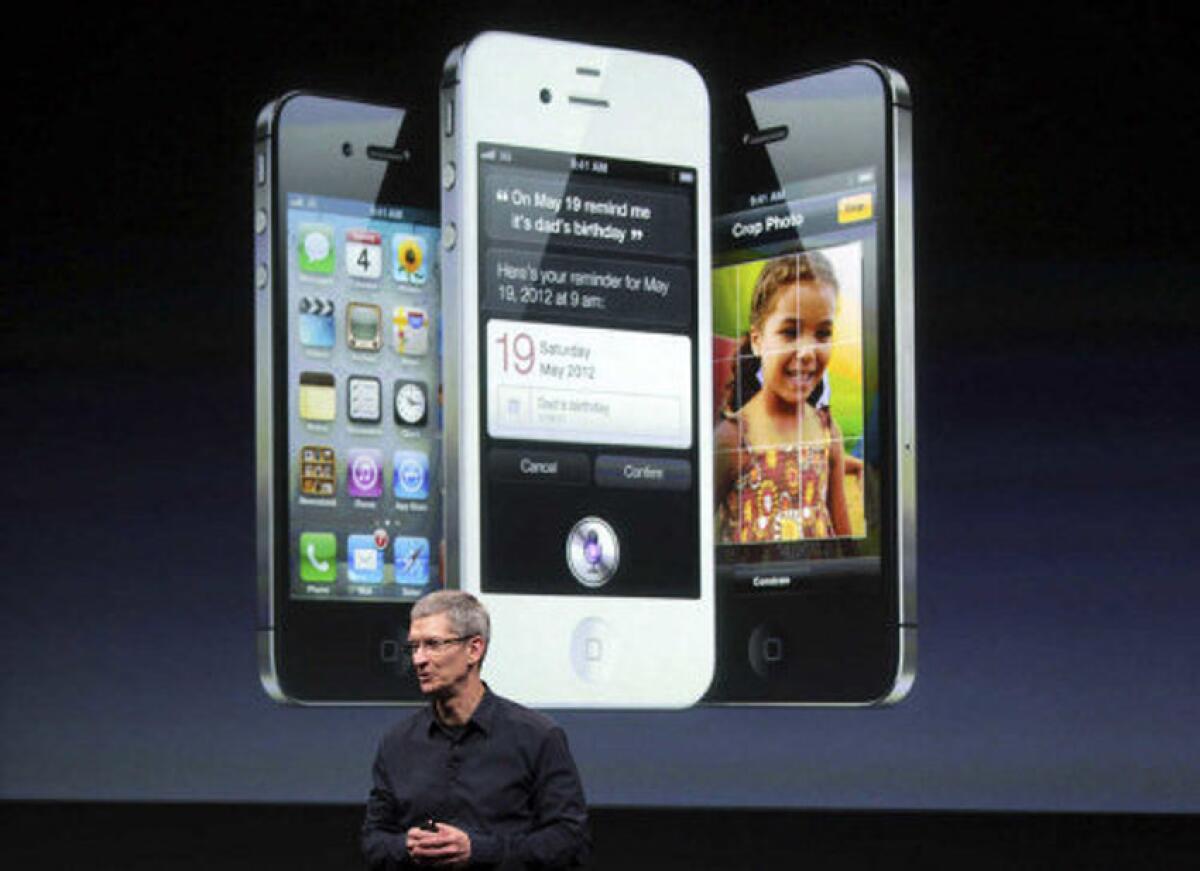 Apple Chief Executive Tim Cook unveiling the iPhone 4S in 2011.