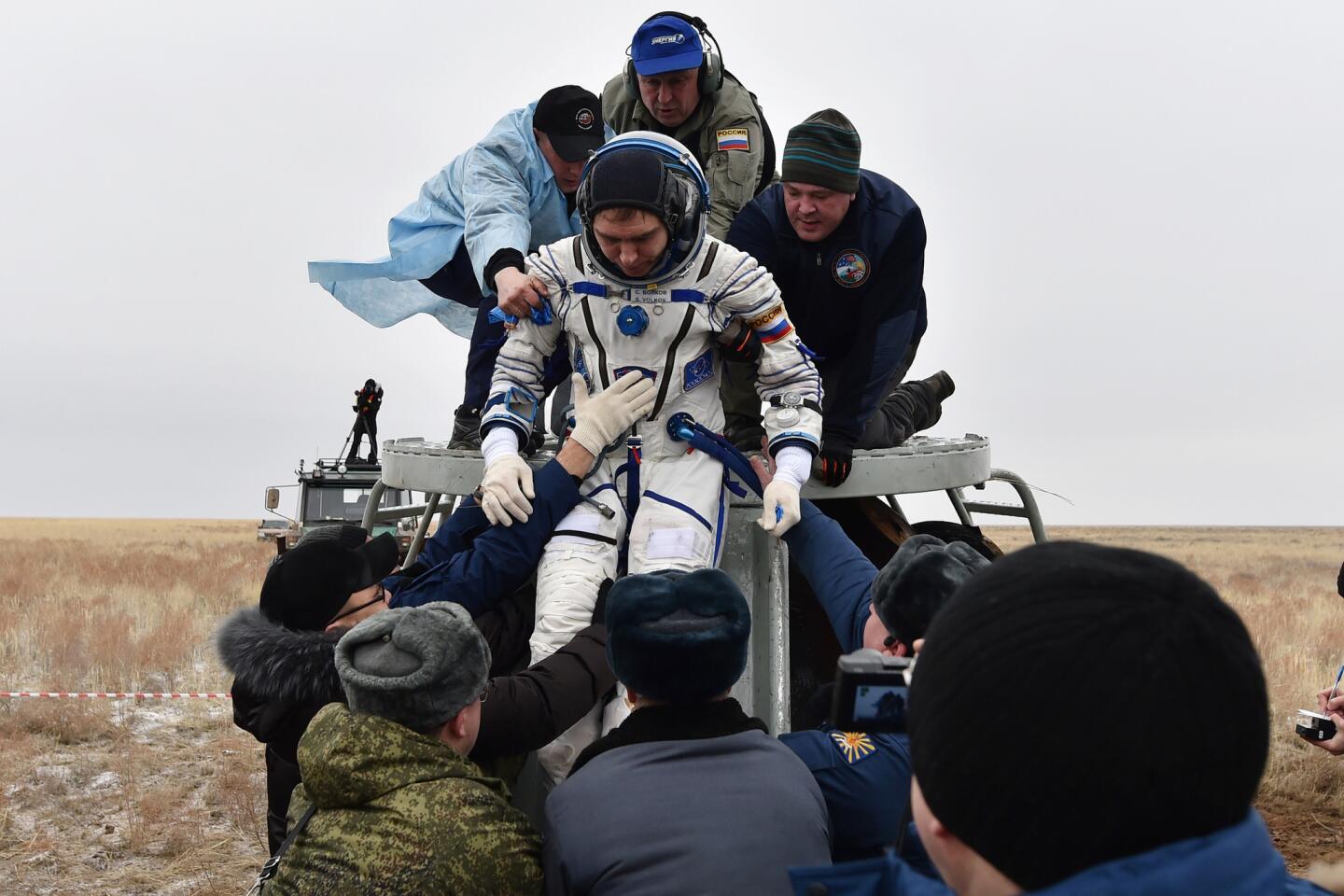 Astronauts return from space