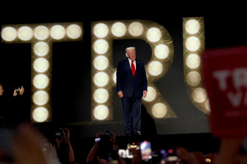 MILWAUKEE, WI JULY 18, 2024 -- Republican presidential candidate former President Donald Trump walks on the stage during the Republican National Convention on Thursday, July 18, 2024. (Jason Almond / Los Angeles Times)