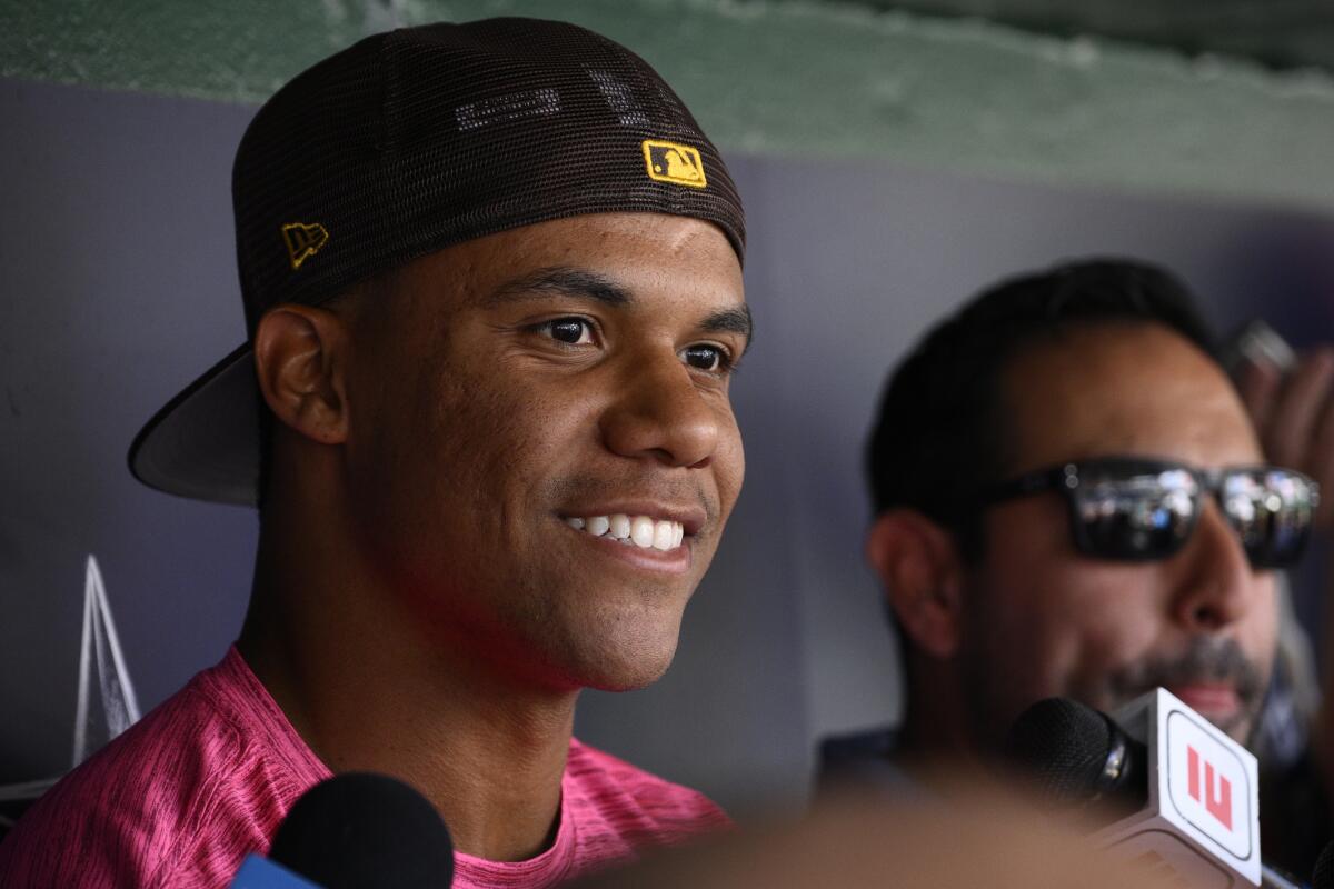 San Diego Padres' Juan Soto talks to the media before a baseball game against the Washington Nationals, Friday, Aug. 12, 2022, in Washington. (AP Photo/Nick Wass)