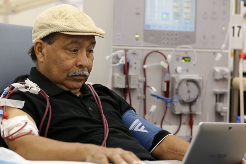 ADVANCE FOR RELEASE SATURDAY, OCT. 6, 2018, AND THEREAFTER - In this photo taken Monday, Sept. 24, 2018, Adrian Perez undergoes dialysis at a DaVita Kidney Care clinic in Sacramento, Calif. If approved by voters in November, Proposition 8, would limit dialysis clinics' profits. (AP Photo/Rich Pedroncelli)