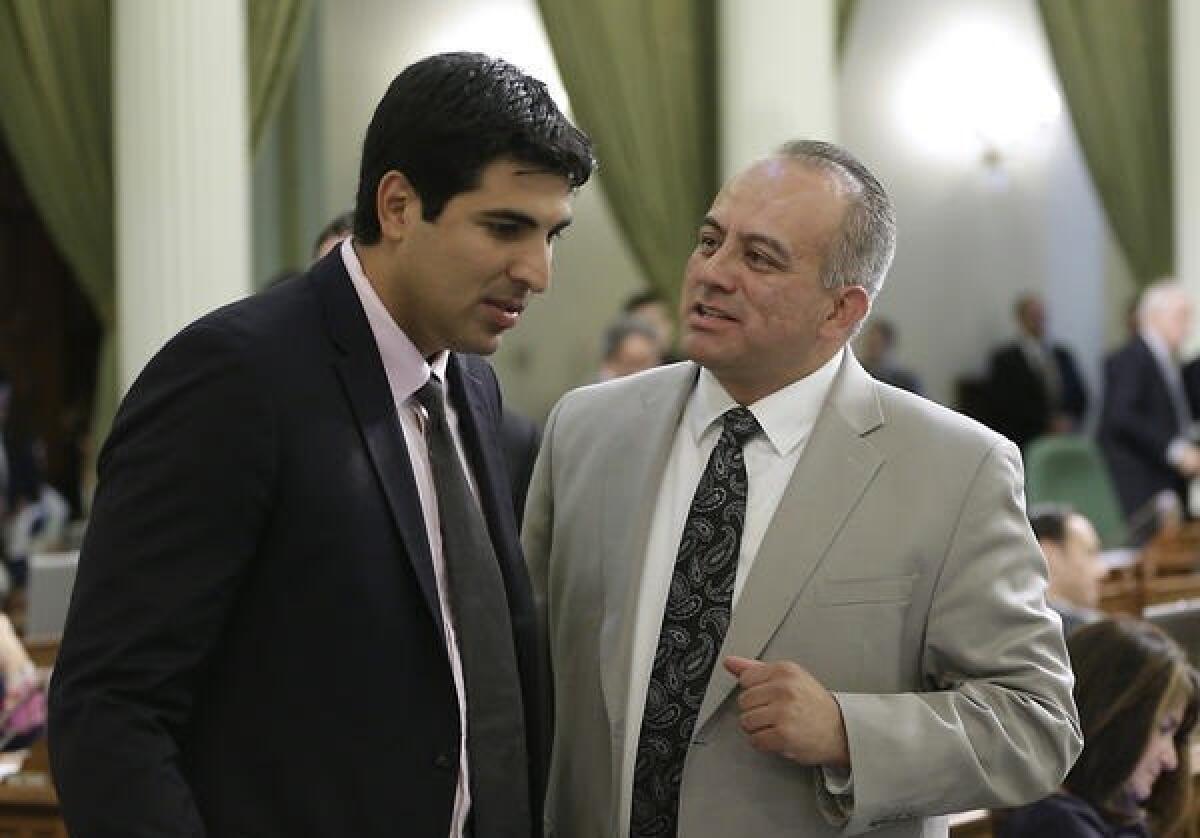 Raul Bocanegra, right, in a 2014 file photo when he was a member of the California Assembly. (Rich Pedroncelli / Associated Press)