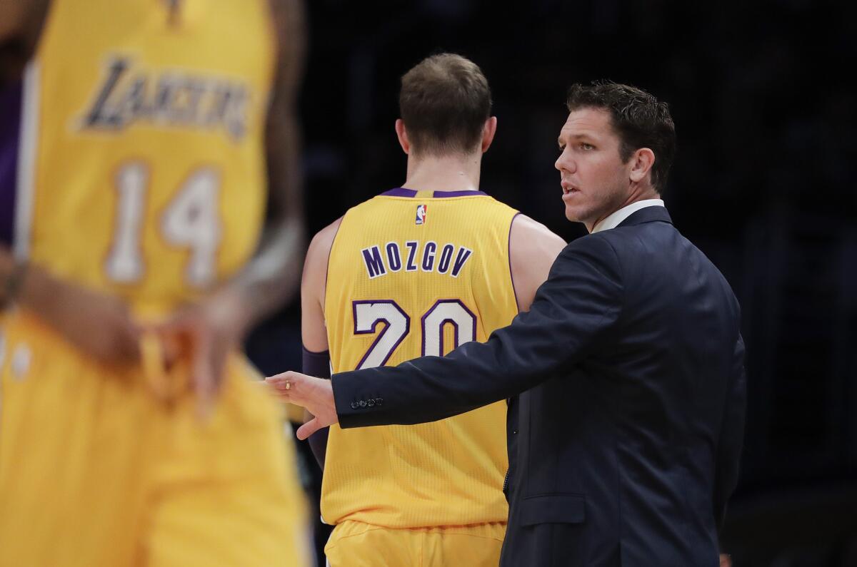 Luke Walton coaches the Lakers against Denver on Oct. 7.