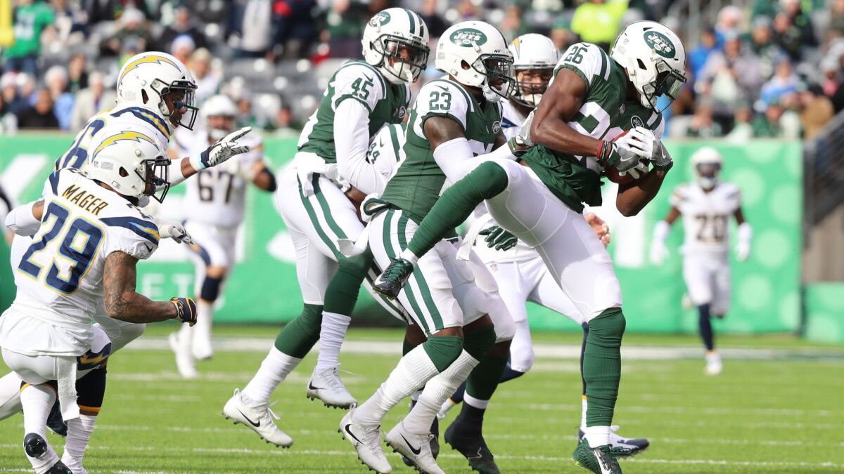 Marcus Maye of the New York Jets recovers an onside kick on the opening play of the game against the Los Angeles Chargers on Sunday.