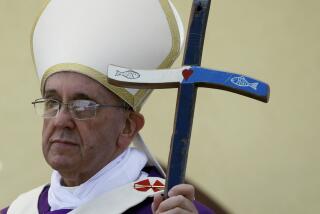 Pope Francis holds his pastoral staff, made from recycled wood from broken migrant boats, at the end of a Mass during his visit to the island of Lampedusa, southern Italy, Monday July 8, 2013. Ten years after Pope Francis made a landmark visit to the Italian island of Lampedusa to show solidarity with migrants, he is joining Catholic bishops from around the Mediterranean this weekend in France to make the call more united, precisely at the moment that European leaders are again scrambling to stem the tide of would-be refugees setting off from Africa. (AP Photo/Gregorio Borgia, File)