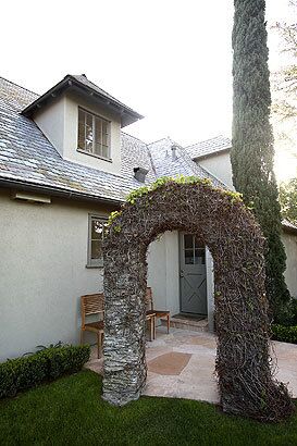 Vines on an arch begin to leaf out. "What's so interesting to me is that Claire saw this traditional space, and then figured out how to reconfigure it in a way that would suit her modern lifestyle. But she did that without losing this sense of traditional elegance," says friend and frequent visitor Jamie Rosenthal, owner of the Hollywood clothing and furniture emporium Lost & Found Etcetera. "Knowing her, I think she really loved that idea of this house being both an old-world place where she can live for the rest of her life and a modern home where she could raise her kids. The house melds those ideas so gracefully."