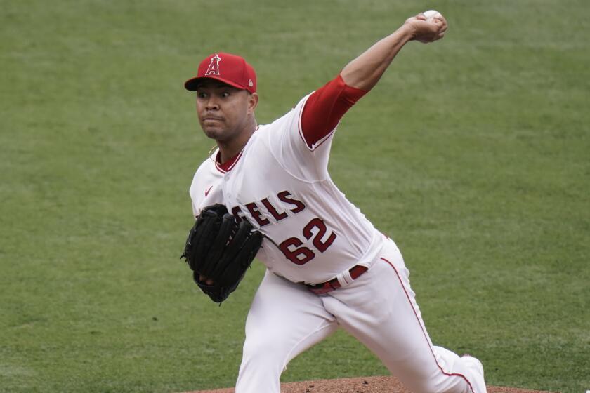 Los Angeles Angels starting pitcher Jose Quintana throws the ball against the Texas Rangers.