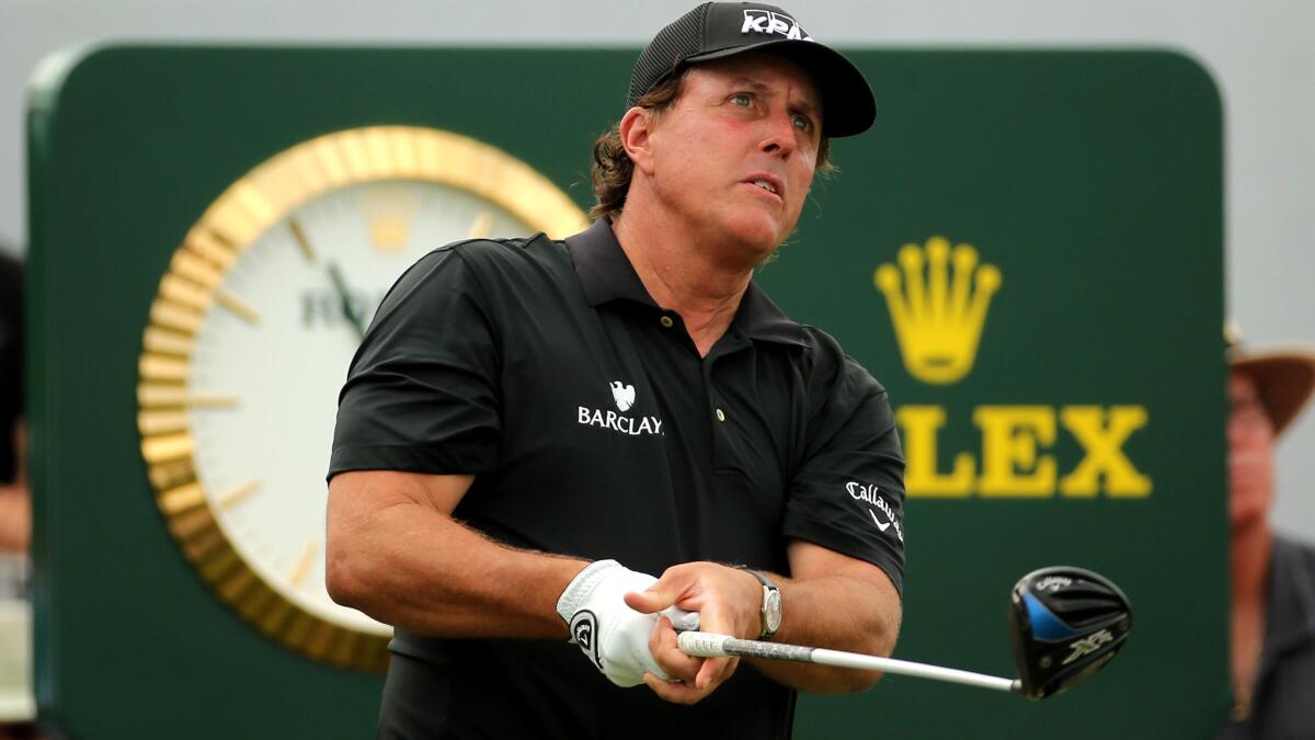 Phil Mickelson watches his tee shot at No. 10 during the first round of the WGC Cadillac Championship at the Trump National Doral Blue Monster Course on Thursday.