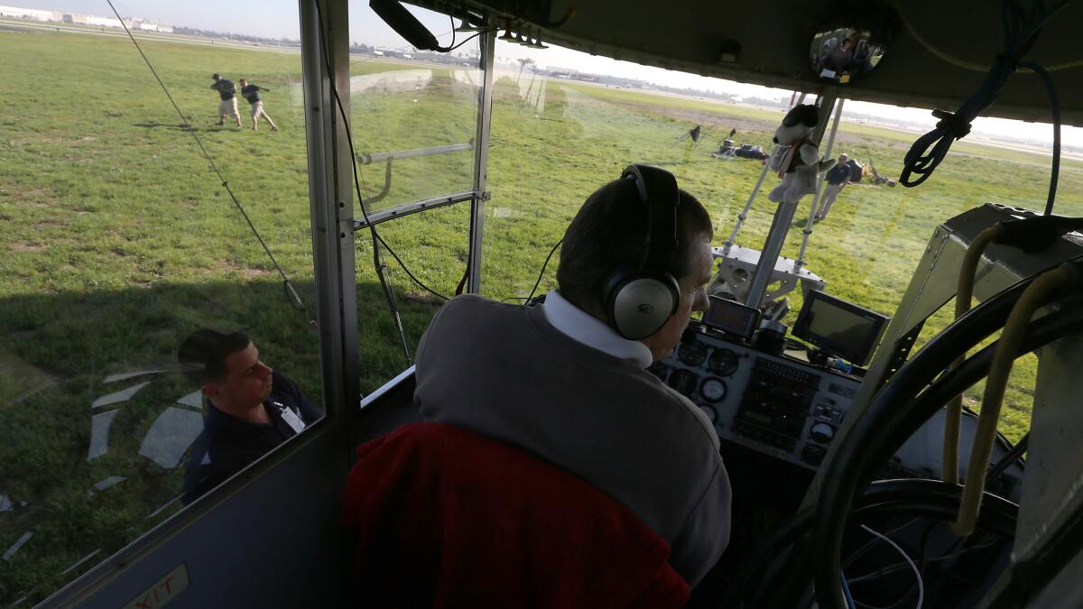 Pilot Allan Judd prepares to take off from the Long Beach Airport at the controls of the MetLIfe blimp Snoopy Two on Friday.