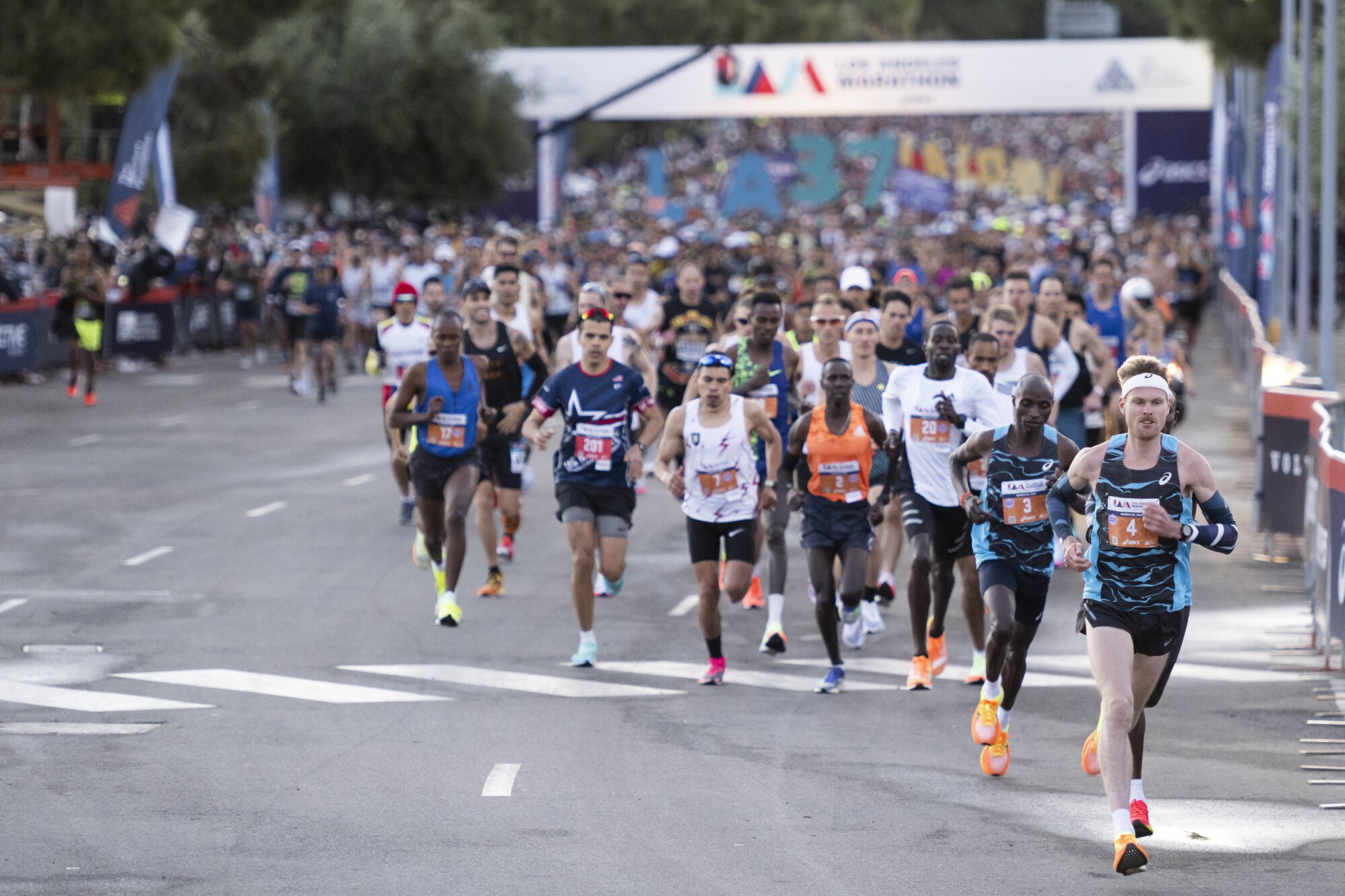 Runners take off from Dodger Stadium during the Los Angeles Marathon.