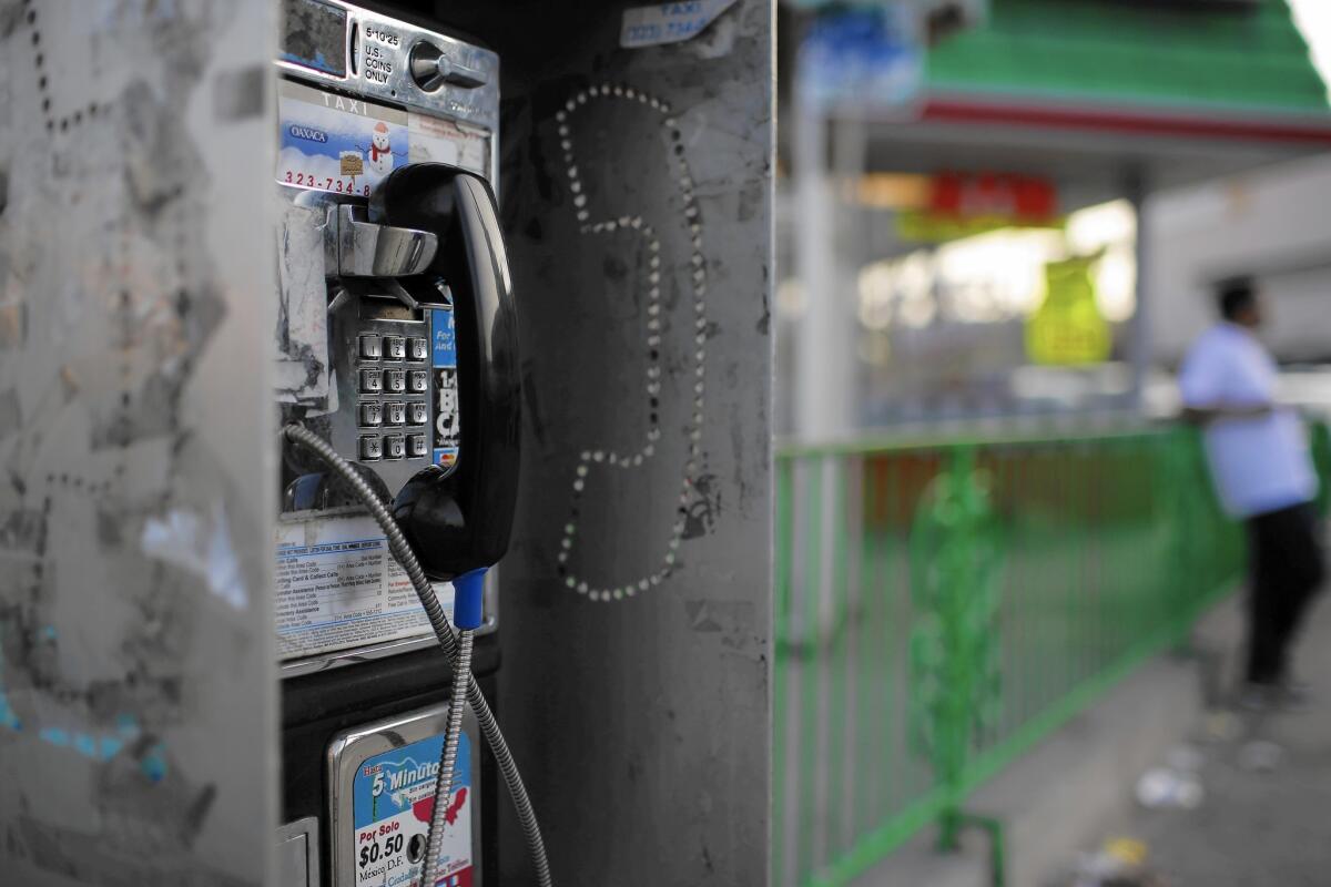 A pay phone at Martin Luther King Boulevard and Crenshaw Boulevard in Los Angeles. Statewide, the number of pay phones has decreased by more than 70% since 2007. But there are still thousands left.