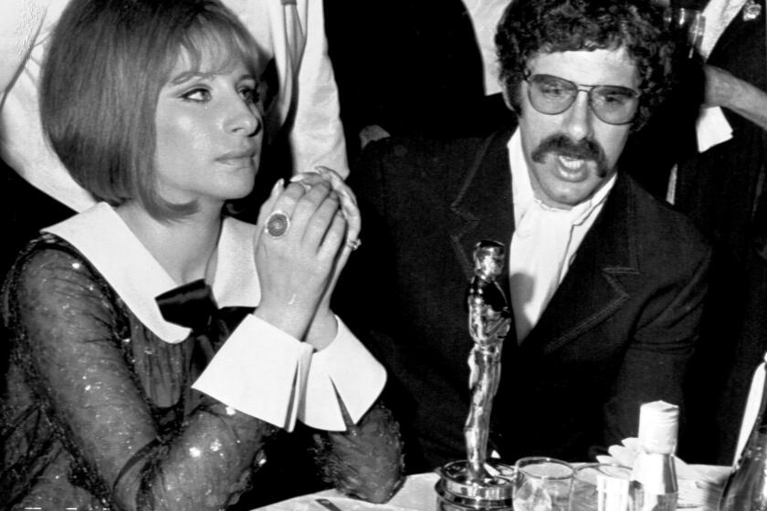 Actor Elliot Gould and his singer-actress wife Barbra Streisand attend the Academy Awards Ceremony, April 1969, in Hollywood. Barbra won an Oscar for her part in the film 'Funny Girl'. (AP Photo)