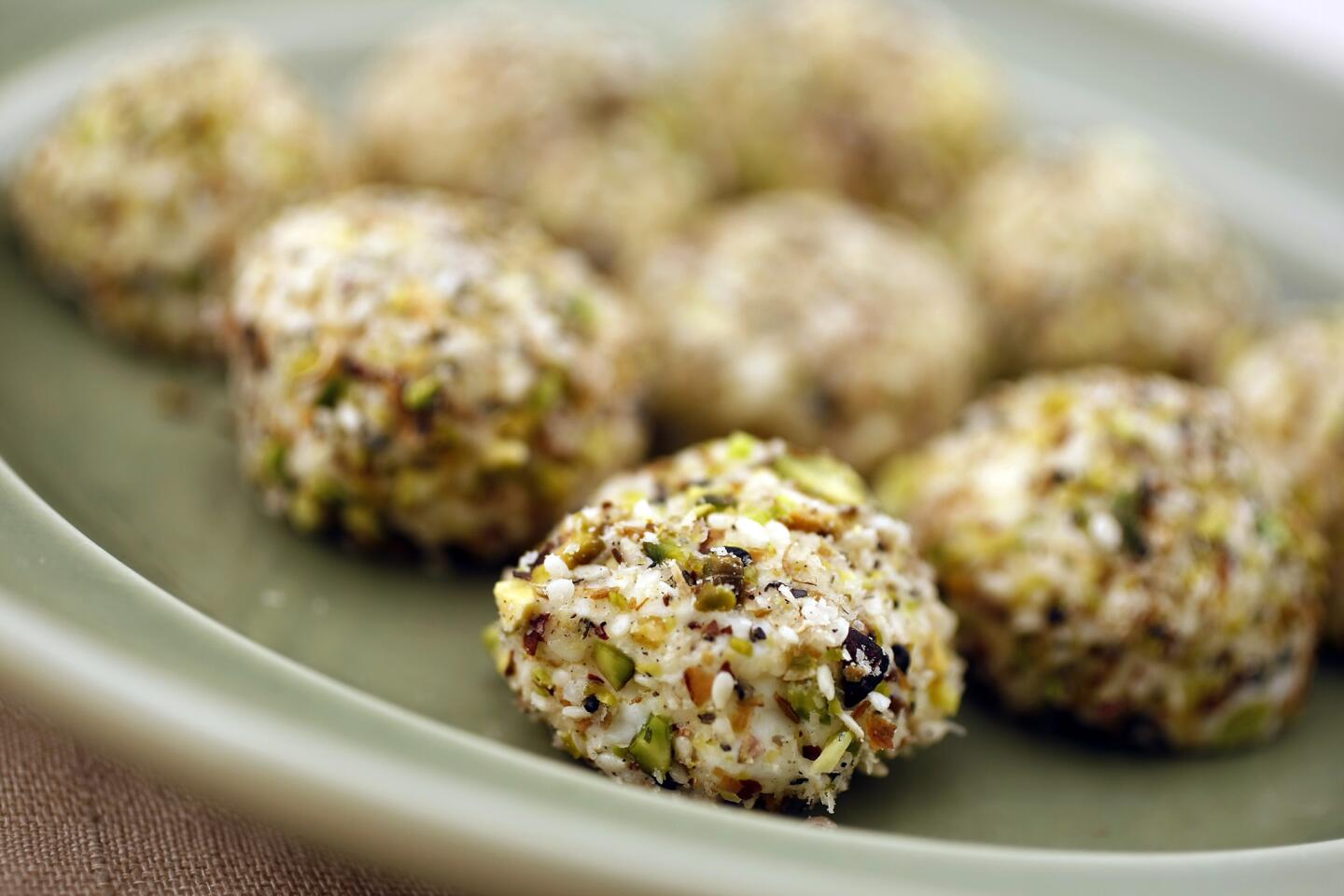 Cream cheese balls with sesame and pistachios