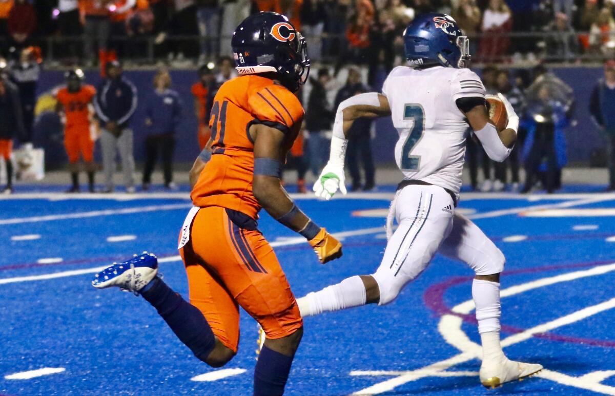 Sierra Canyon’s DJ Harvey scores on a 78-yard punt in the first half of Friday’s Southern Section Division 2 final in West Hills. Sierra Canyon defeated Chaminade, 35-7.