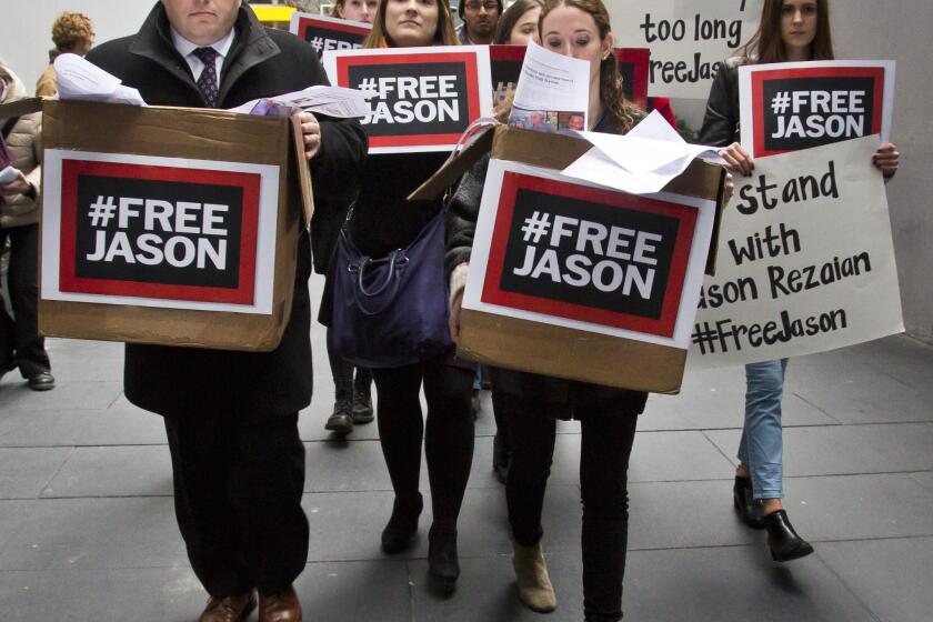 Ali Rezaian, far left, and supporters deliver a petition to Iran's United Nations mission in New York calling for the release of his brother, Washington Post reporter Jason Rezaian.