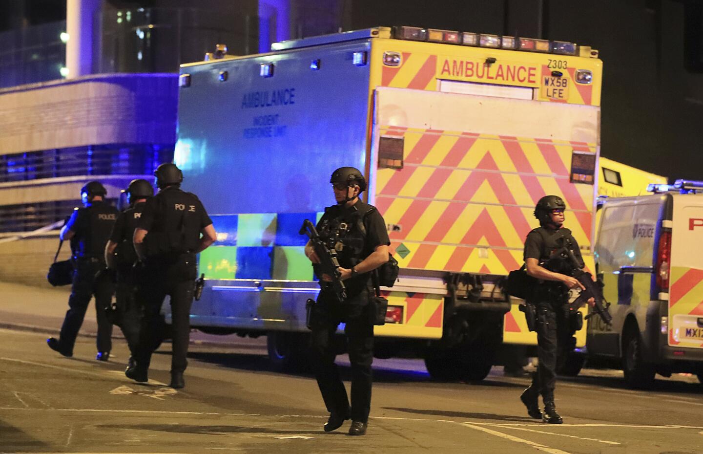 Armed police and ambulances at Manchester Arena after reports of an explosion at the venue during an Ariana Grande concert Monday night.