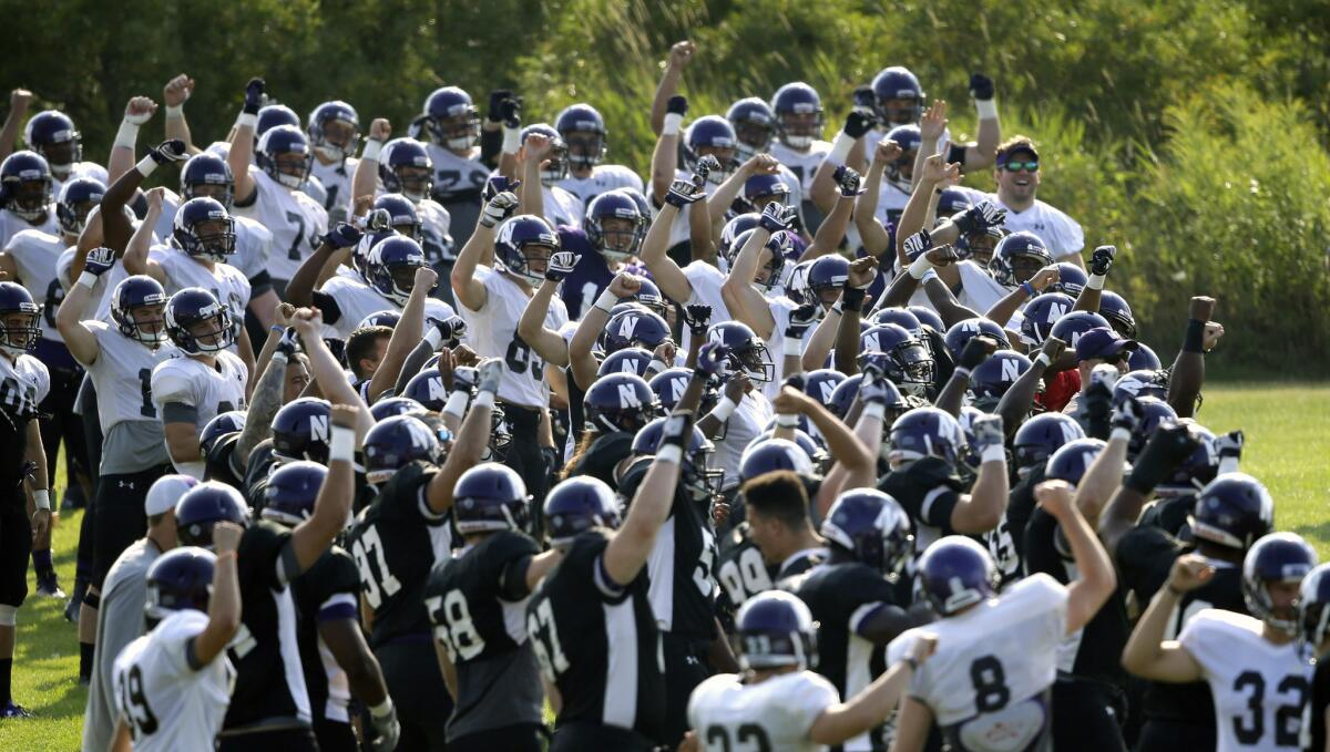 Northwestern football players practice at the University of Wisconsin-Parkside campus on Aug. 17.