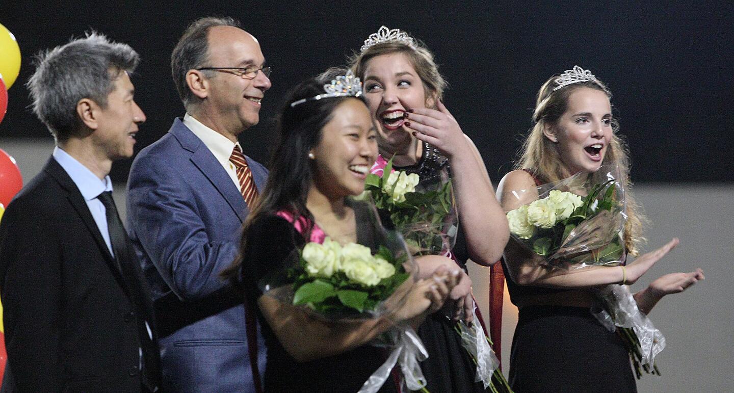 Abby Rosen reacts to being chosen homecoming queen during halftime at the La Cañada High School football game on Friday, Oct. 16, 2015.