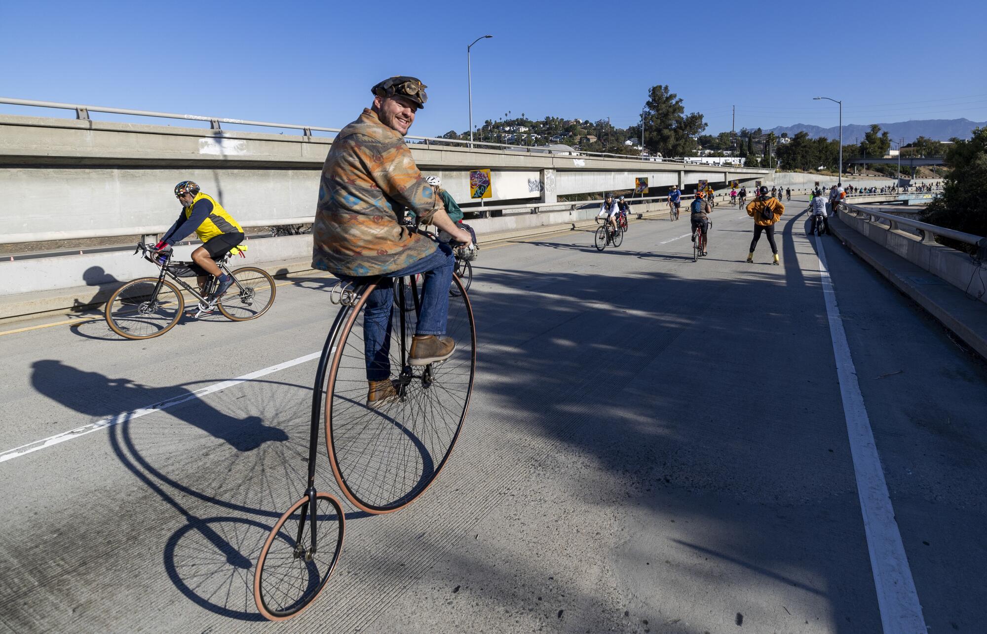Alex Trepanier, 35, rides his pennyfarthing, the same bike he rode 20 years ago at ArroyoFest when he was a teenager.