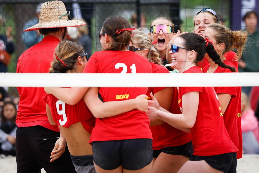 San Diego, CA - May 04: Cathedral Catholic players celebrate a match won against Torrey Pines during the CIF San Diego Section beach volleyball Open Division championship at Miramar College on Saturday, May 4, 2024 in San Diego, CA. (Meg McLaughlin / The San Diego Union-Tribune)