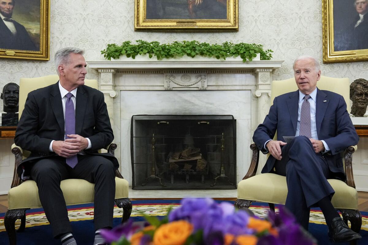 Kevin McCarthy sits in the Oval Office with President Biden.