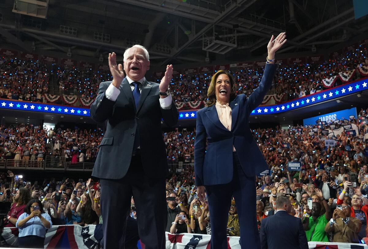 Democratic presidential candidate, Kamala Harris and Tim Walz appear on stage together.