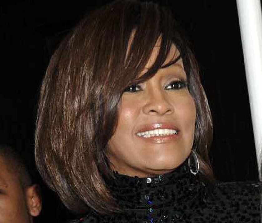 Whitney Houston arrives at Clive Davis' annual pre-Grammy party in Beverly Hills.