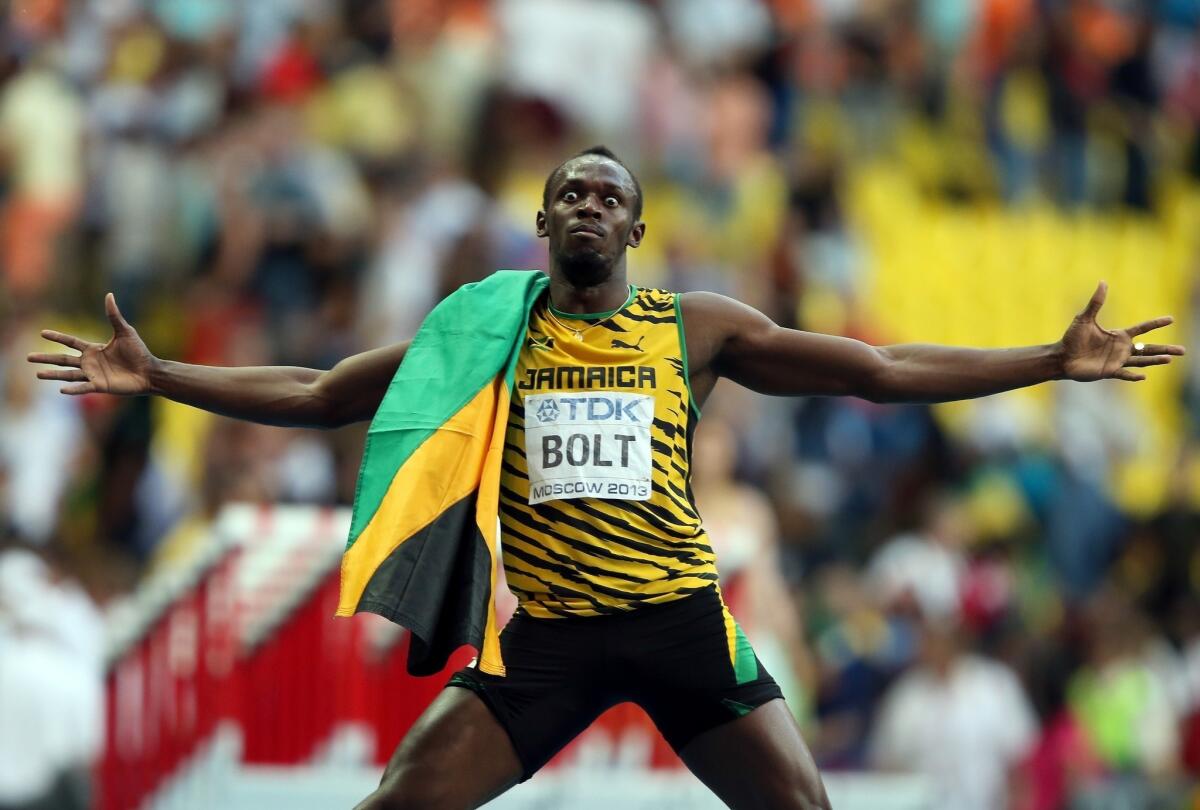 Jamaican sprinter Usain Bolt celebrates after winning the gold medal in the men's 200 meters during at the world track and field championship Saturday in Moscow.