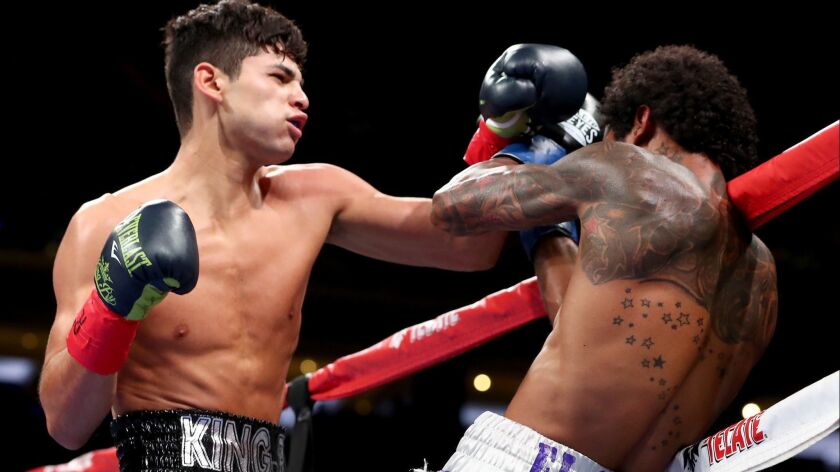 Ryan Garcia, left, battles Braulio Rodriguez during a super-featherweight bout at Madison Square Garden on Saturday in New York City.