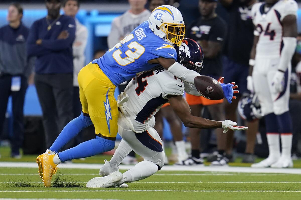 Chargers cornerback Michael Davis (43) breaks up a pass intended for Denver Broncos wide receiver Courtland Sutton.
