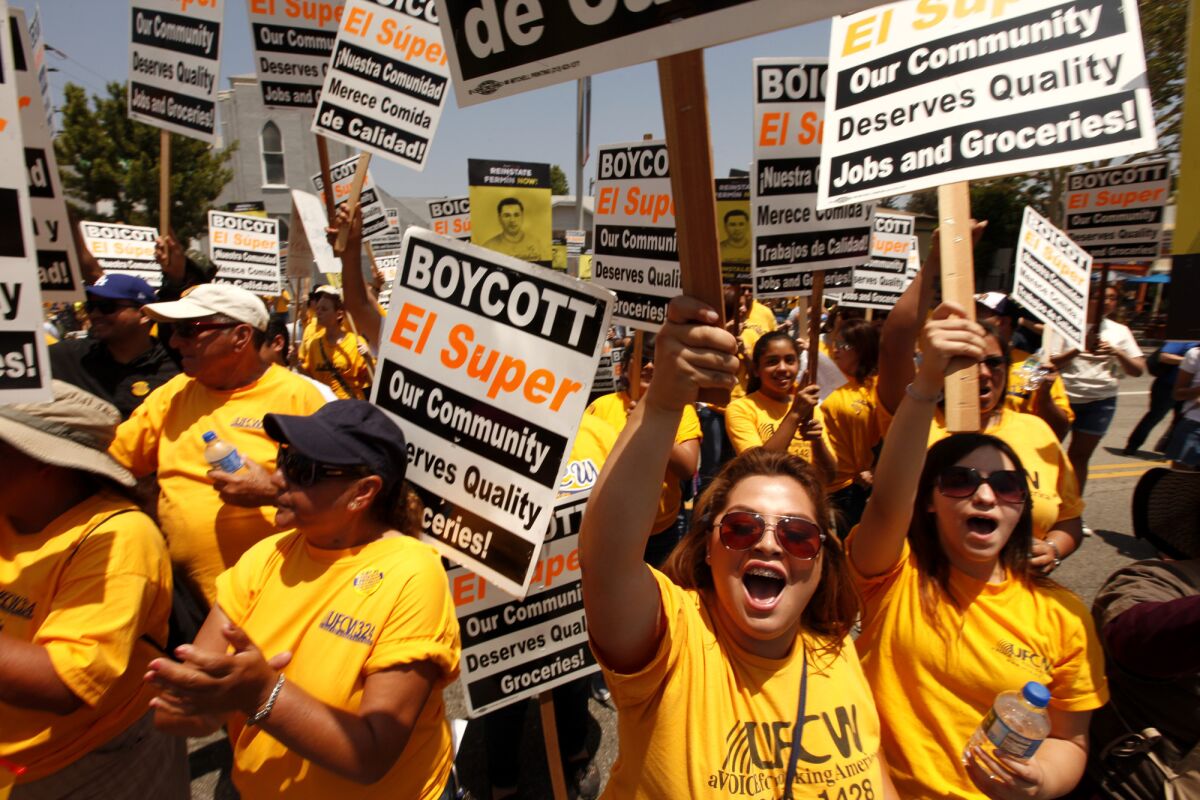 Several hundred El Super workers, labor members and community supporters rally in front of a Highland Park El Super in June, demanding that the chain negotiate a fair contract for workers.