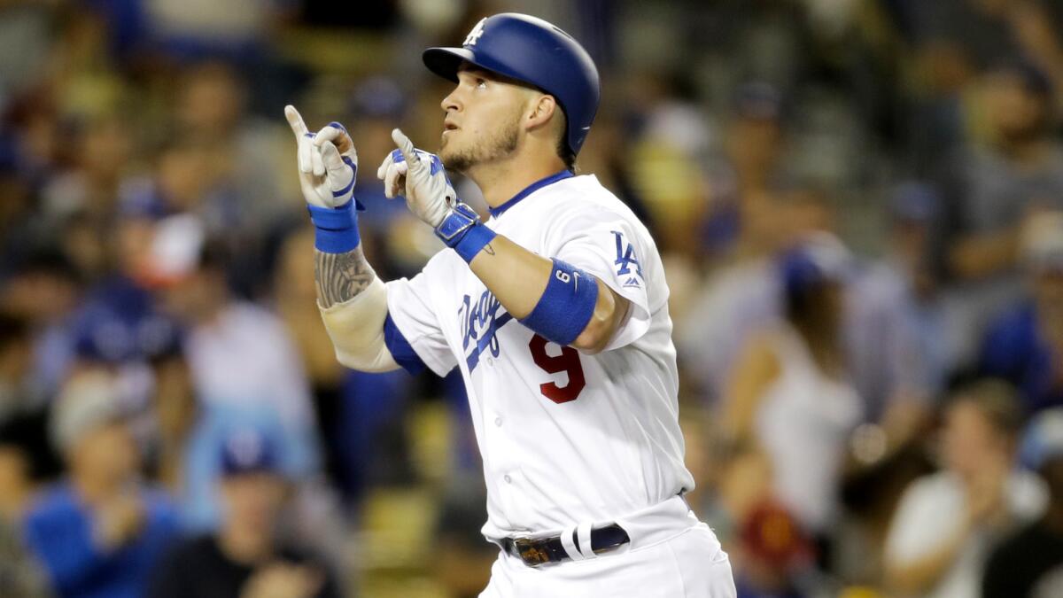 Dodgers catcher Yasmani Grandal celebrates his home run during the second inning Thursday.