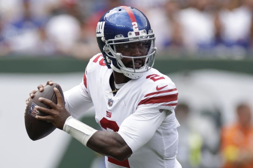 New York Giants quarterback Tyrod Taylor (2) looks to pass in the first half of a preseason.
