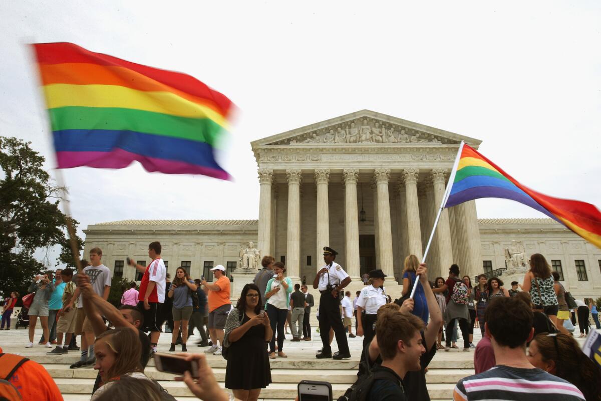 People celebrate in front of the U.S. Supreme Court after the ruling in favor of same-sex marriage in Washington, DC.