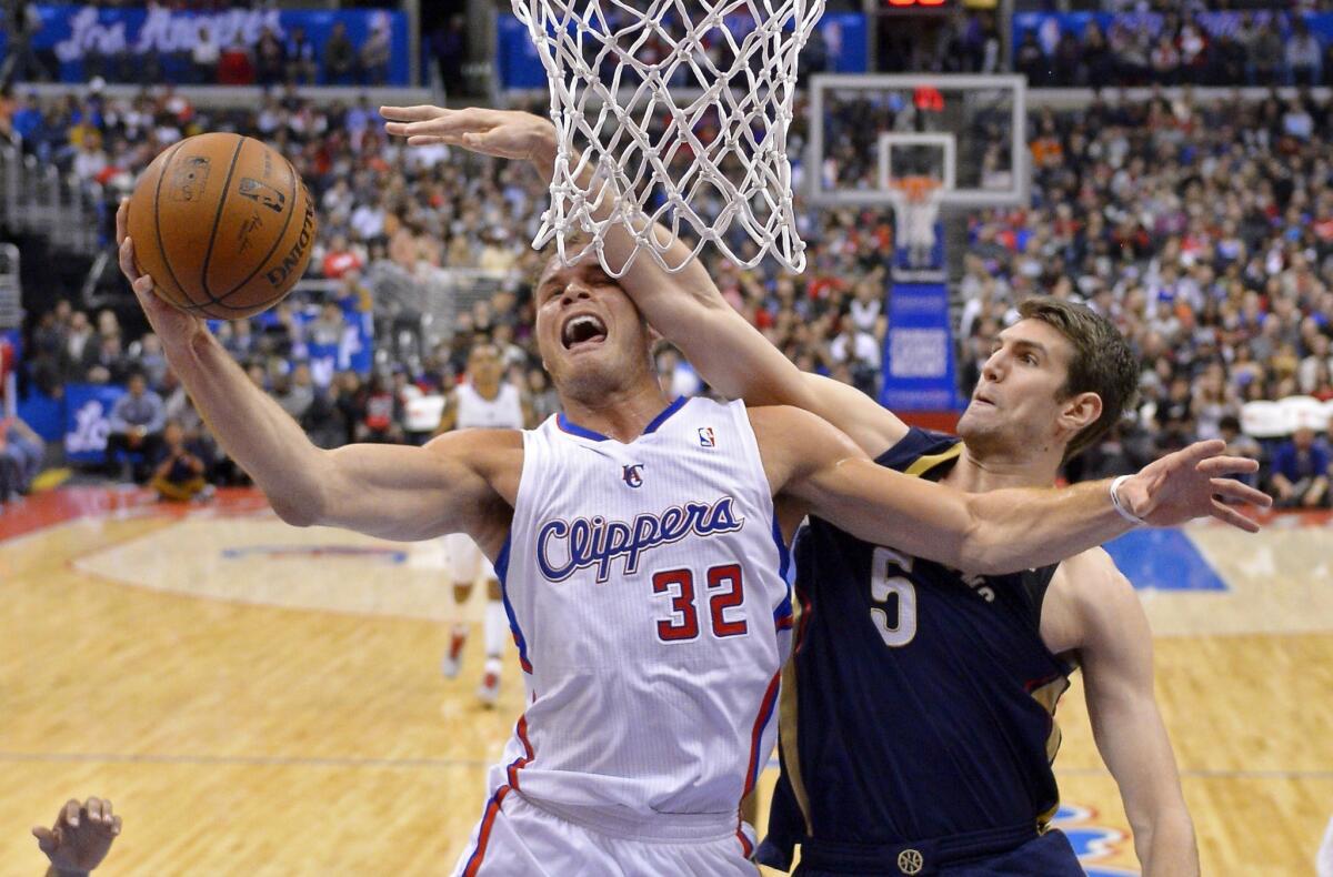 Blake Griffin tries to score against New Orleans Pelicans center Jeff Withey during the Clippers' 108-76 victory Saturday at Staples Center.