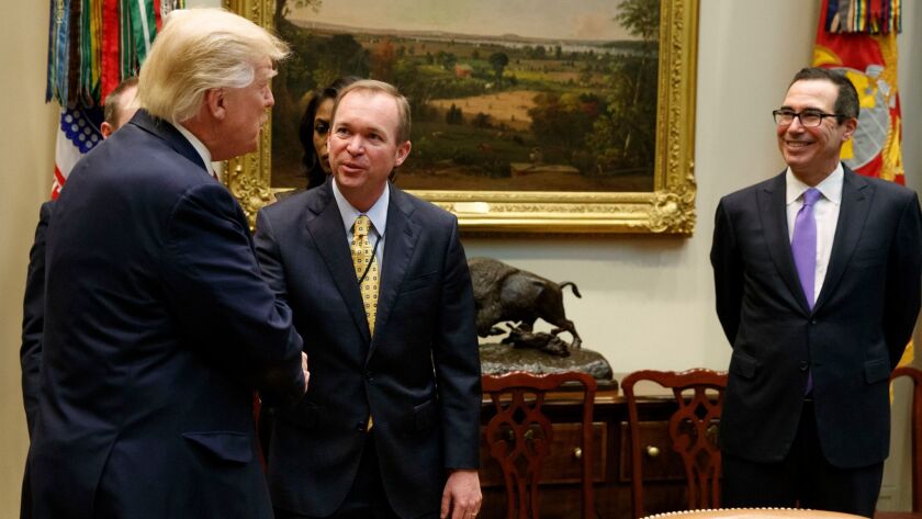 President Trump meets with his fiscal brain trust, budget director Mick Mulvaney, center, and Treasury Secretary Steven Mnuchin. Are they plotting to eviscerate Social Security?
