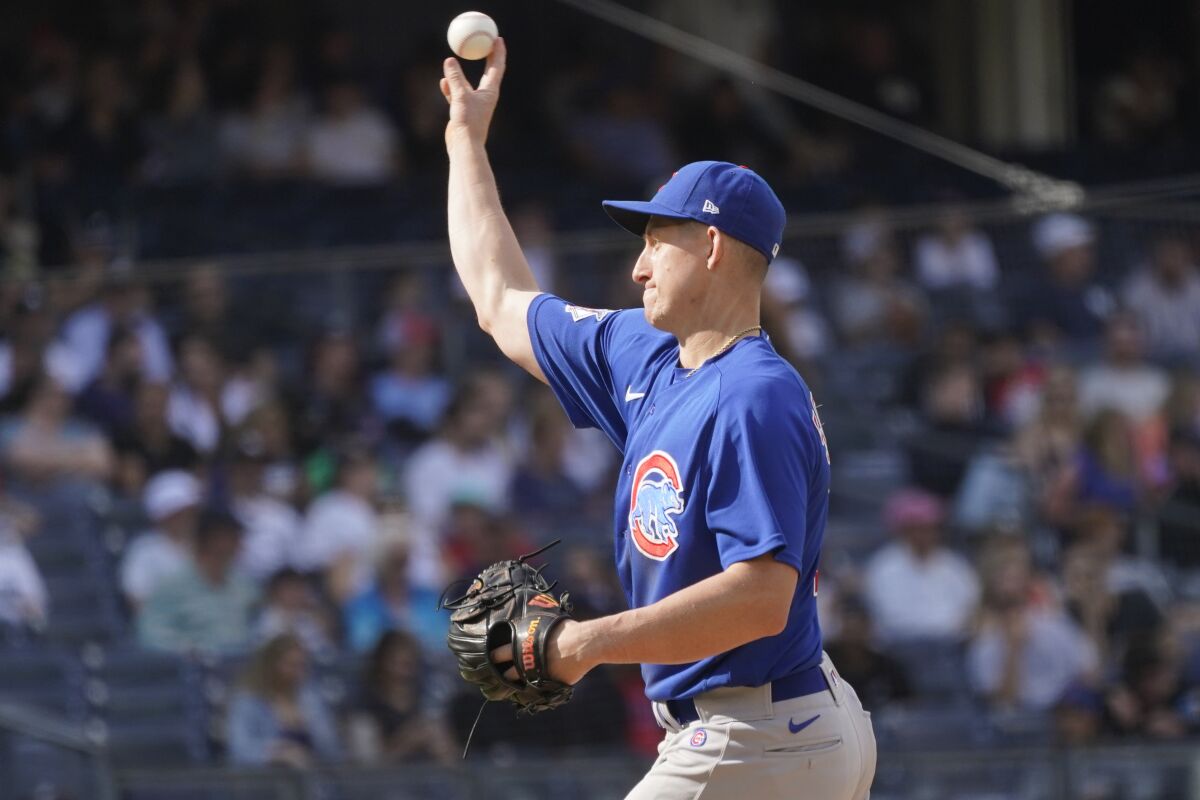 Chicago Cubs first baseman Frank Schwindel pitches in the eighth inning of a baseball game against the New York Yankees, Sunday, June 12, 2022, in New York. (AP Photo/Mary Altaffer)