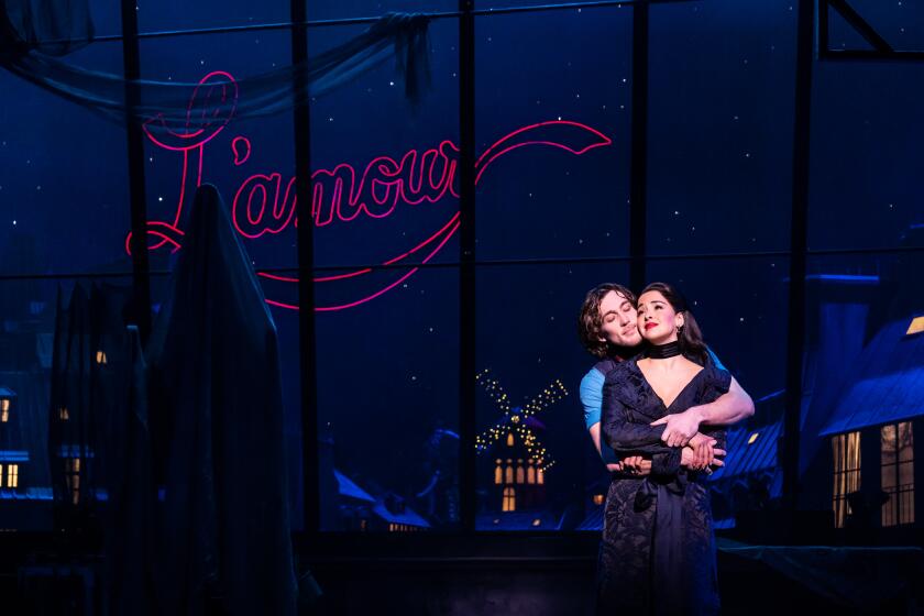 Conor Ryan as Christian and Courtney Reed as Satine in 'Moulin Rouge! The Musical,' now at the Hollywood Pantages Theatre