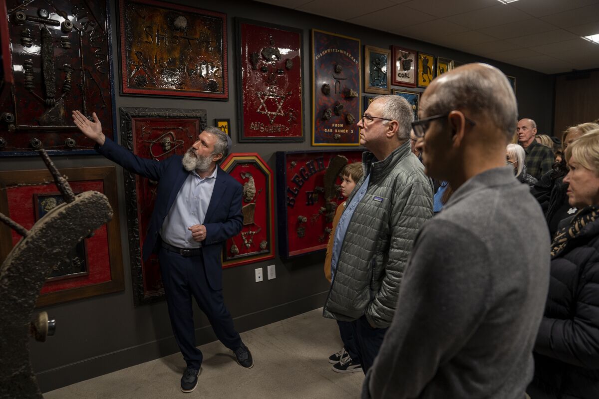 Rabbi Reuven Mintz gives a tour of the Holocaust Education Center in Newport Beach on Sunday.