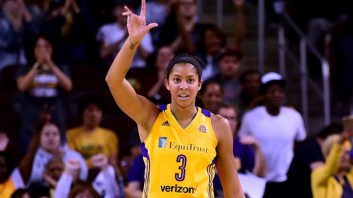 Sparks forward Candace Parker reacts after assisting on a teammate's basket during a Game 3 victory over the Minnesota Lynx on Friday night.