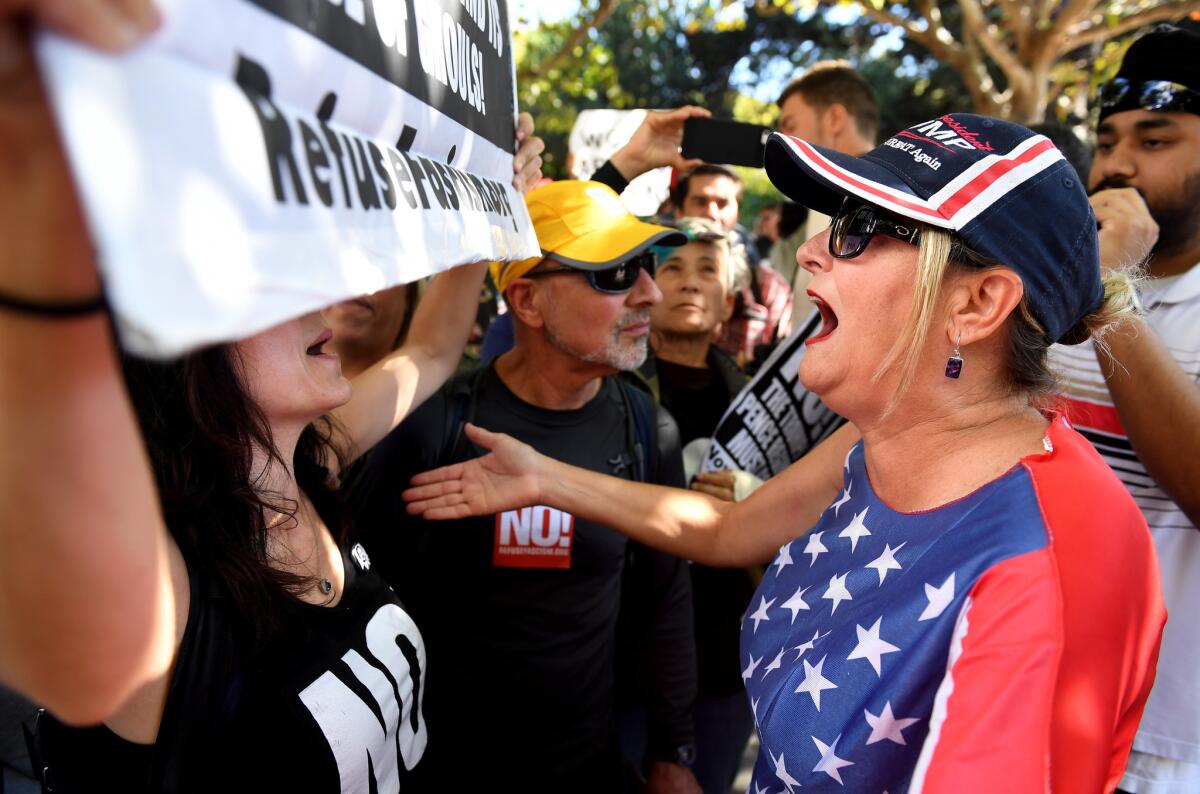 Demonstrators from opposing sides of the political spectrum argue before a speech by Milo Yiannopoulos on Sunday at UC Berkeley. (Wally Skalij / Los Angeles Times)