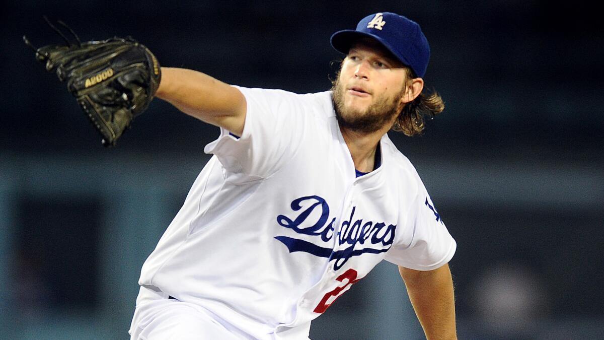 Dodgers starter Clayton Kershaw delivers a pitch during the fourth inning of a 9-4 victory over the San Diego Padres on Monday. Kershaw is the only pitcher in the major leagues with 18 wins this season.