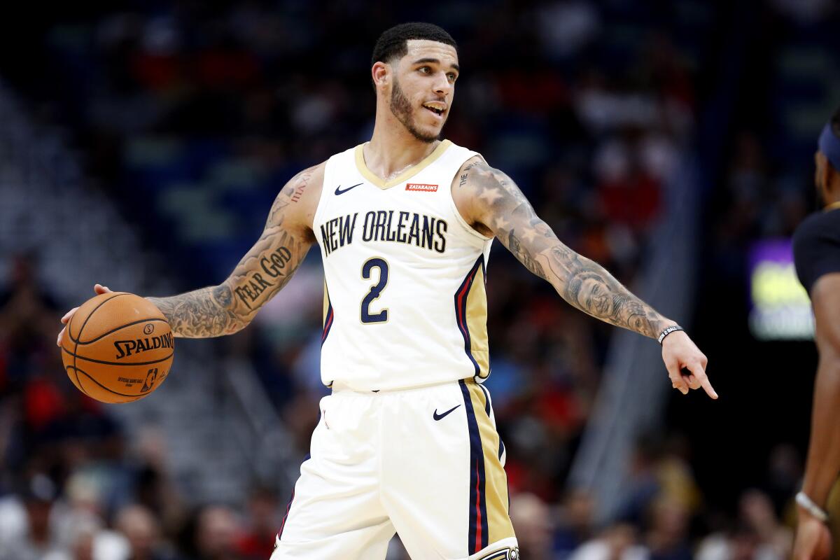 Pelicans guard Lonzo Ball sets up the offense during a preseason game against the Jazz on Oct. 11, 2019.